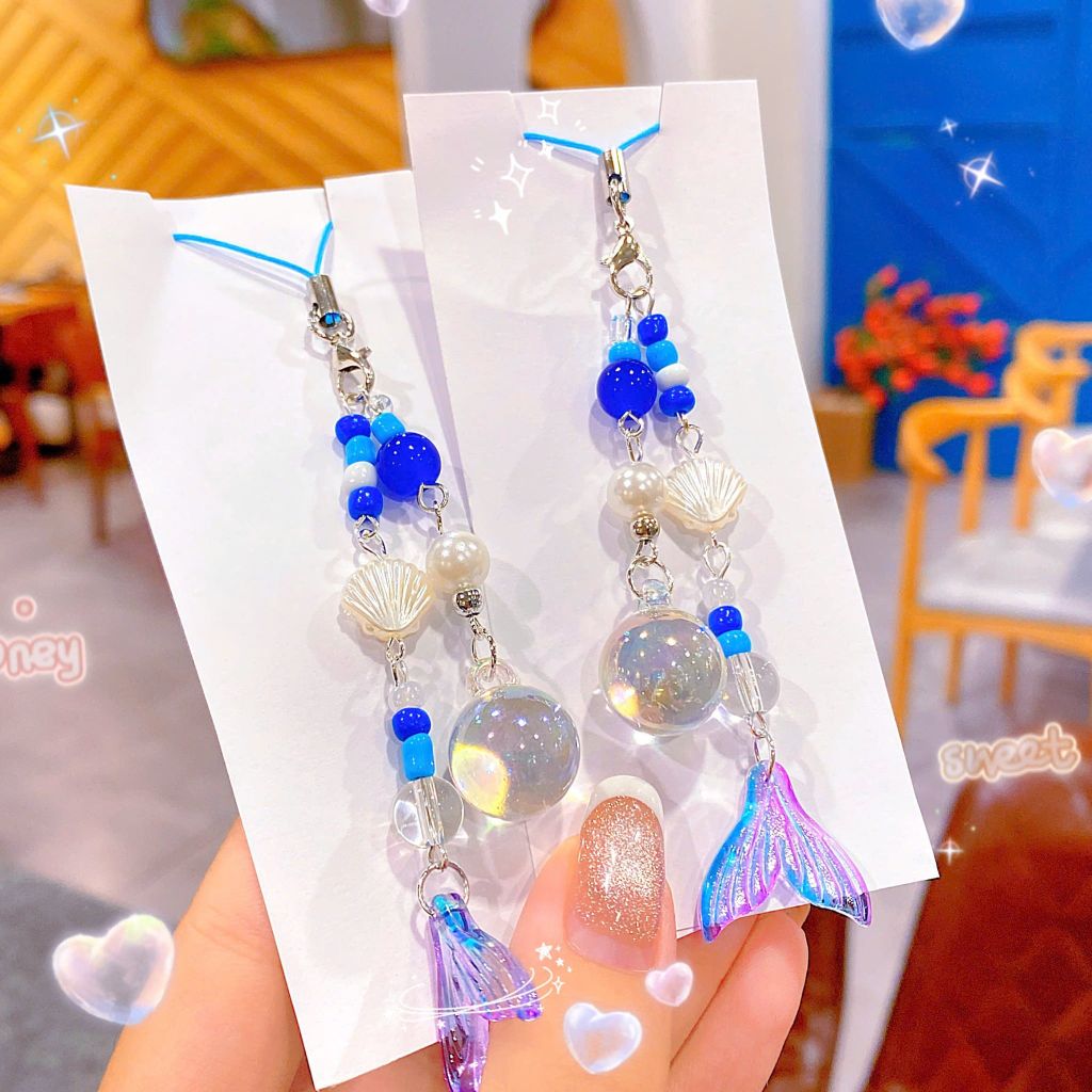 ** Dây đeo điện thoại chuỗi đuôi cá ánh tím