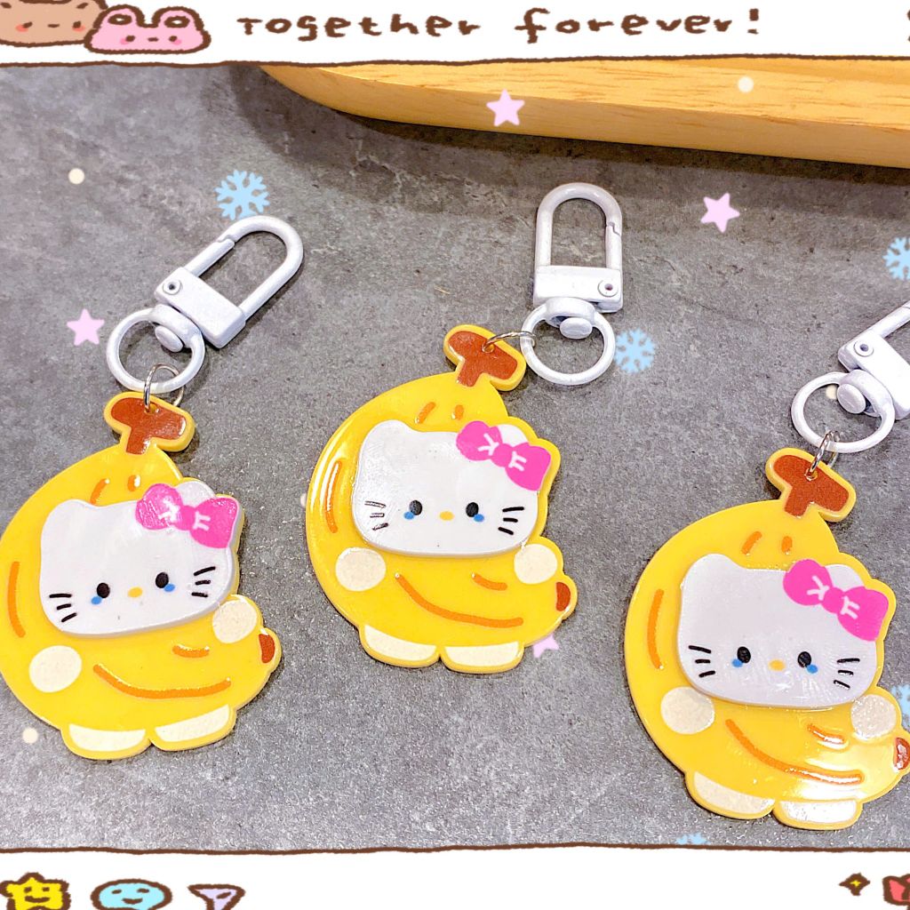 ** Móc khóa chuối đính mặt Kitty