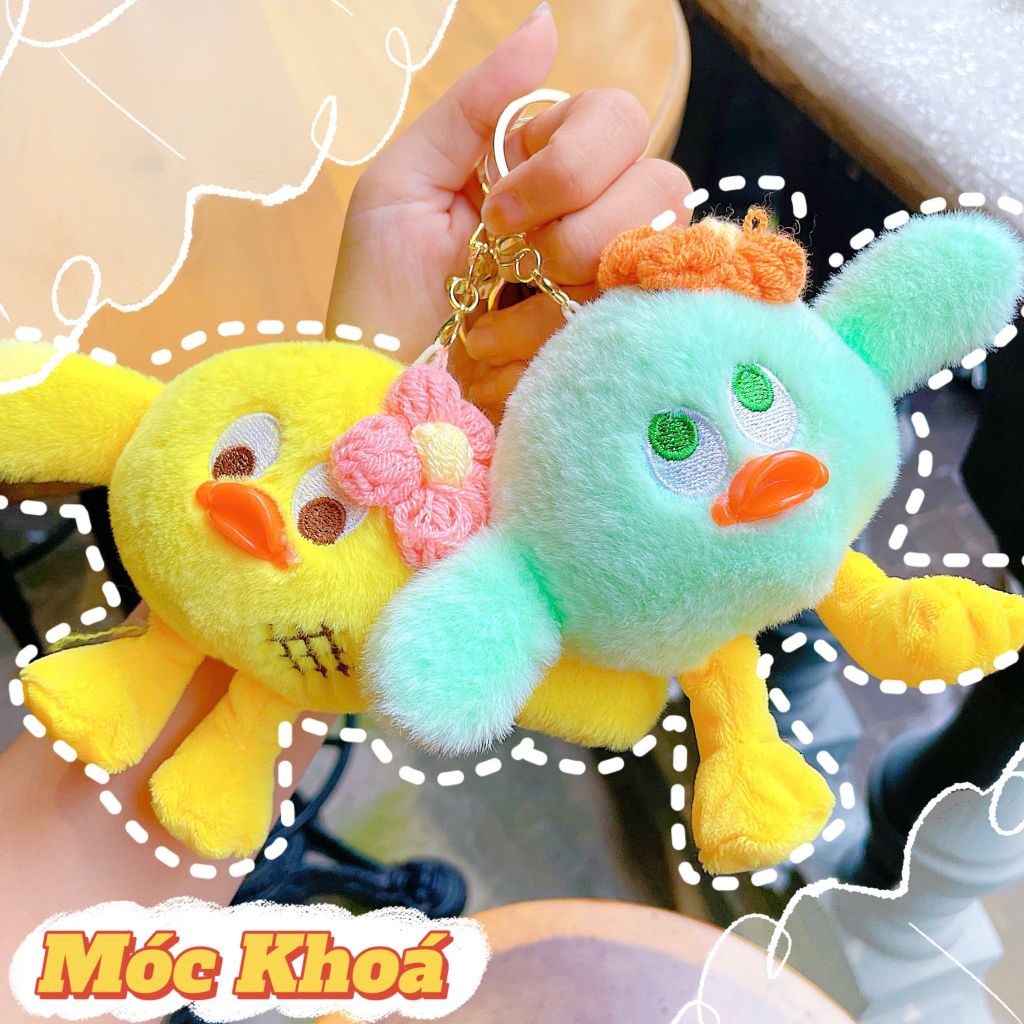 ** Móc khóa vịt chân dài cài hoa len hồng/vàng/XD/XL