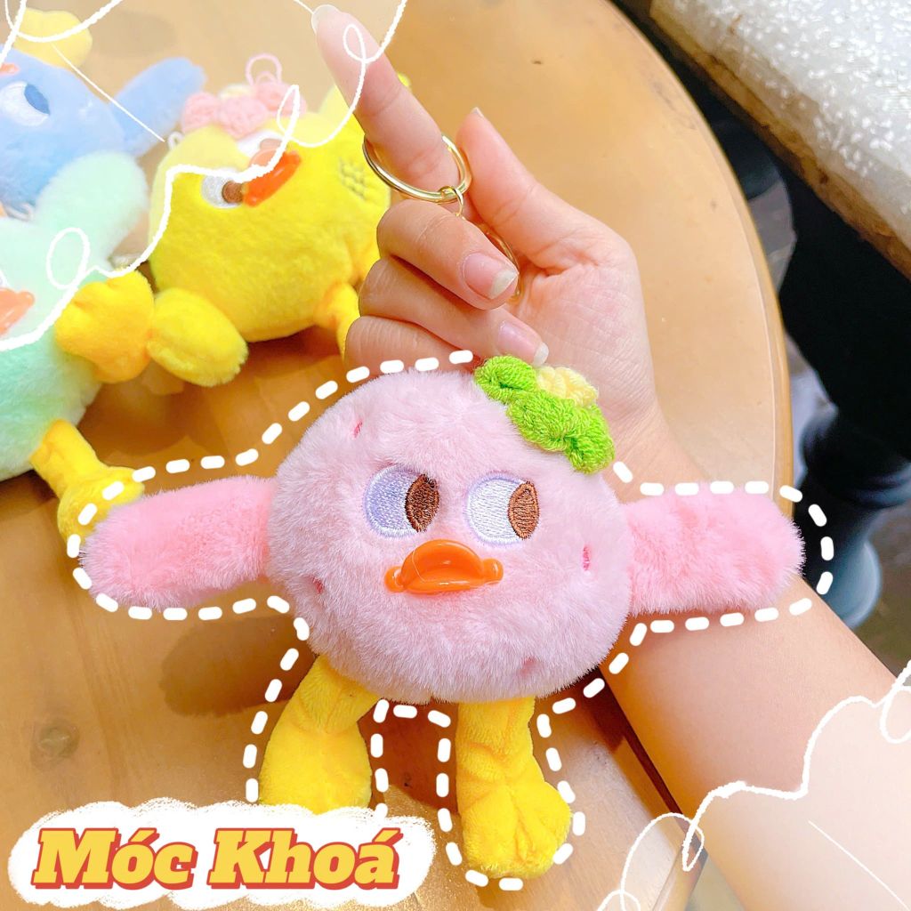 ** Móc khóa vịt chân dài cài hoa len hồng/vàng/XD/XL