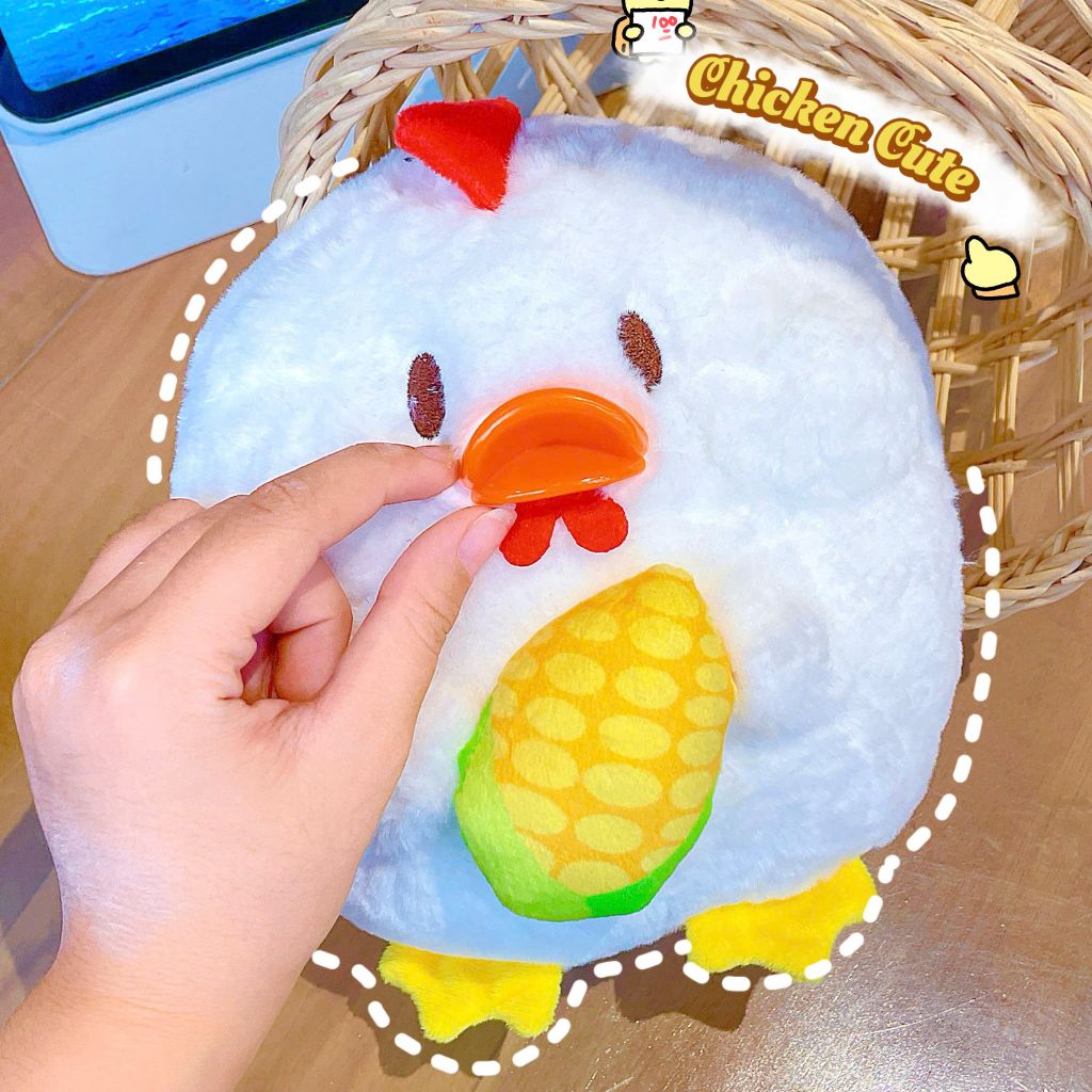 ** Gấu bông gà mỏ cam ôm bắp