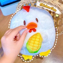 ** Gấu bông gà mỏ cam ôm bắp