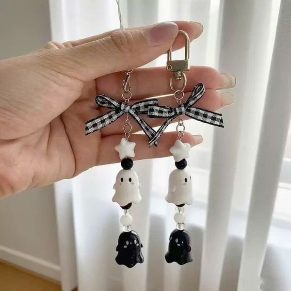 ** Móc khóa/dây đeo con ma chuông