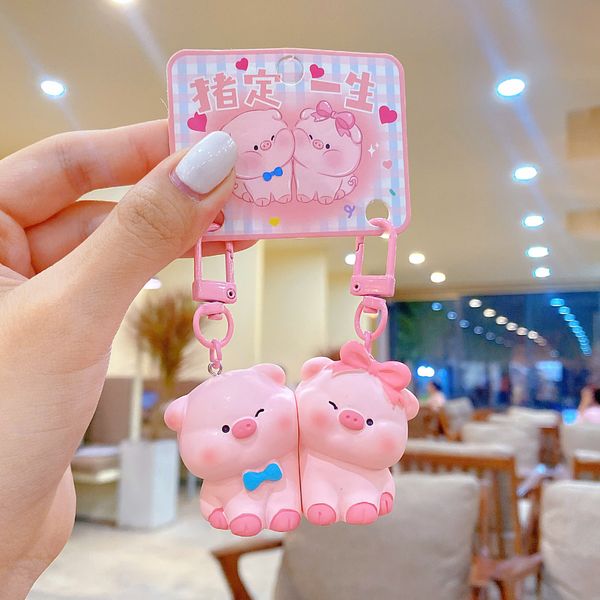 ** Móc khóa đôi heo yêu