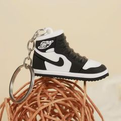 ** Móc khóa dẻo chiếc giày Nike trắng/đỏ