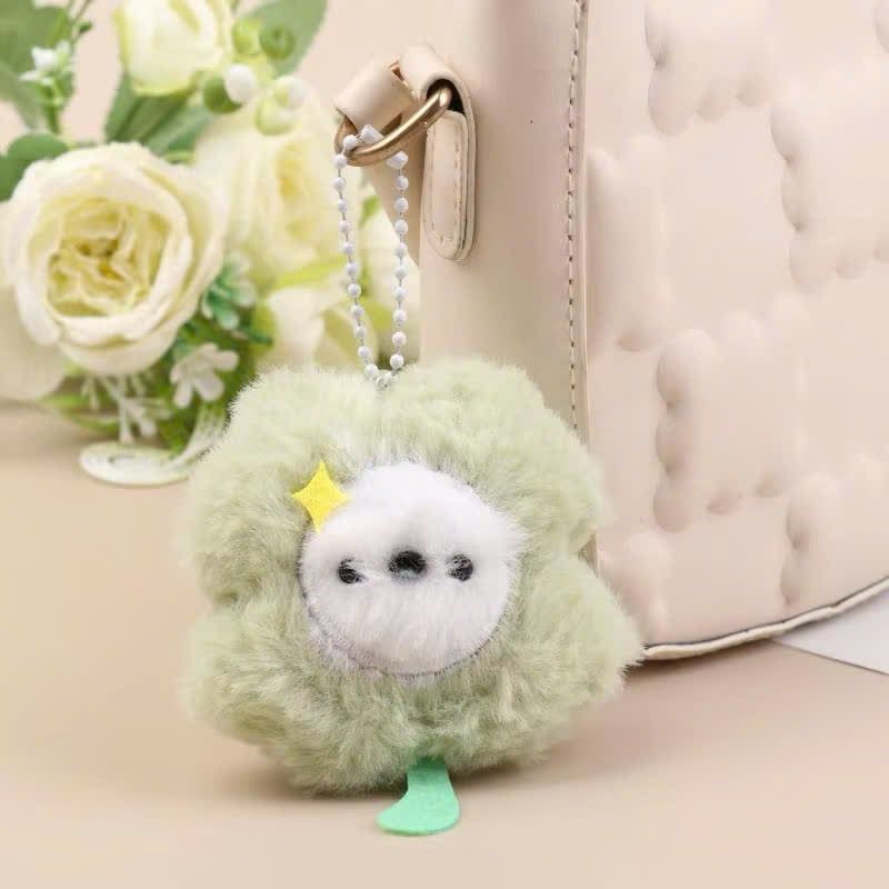 ** Móc khóa bông cỏ bốn lá xanh mặt trắng