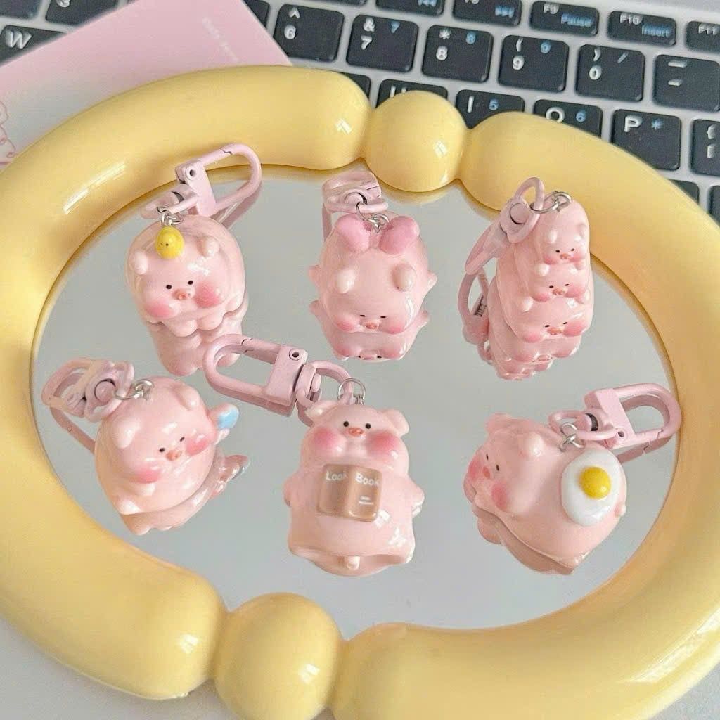 ** Móc khóa mini heo hồng chăm học ham ăn