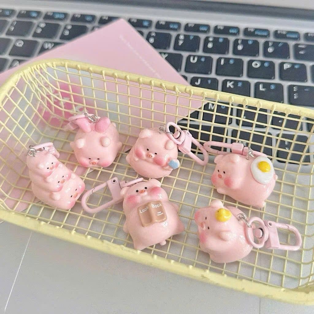 ** Móc khóa mini heo hồng chăm học ham ăn