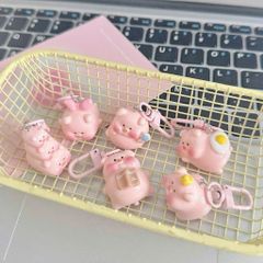 ** Móc khóa mini heo hồng chăm học ham ăn