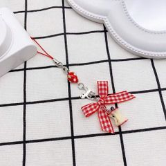 ** Dây đeo điện thoại táo cắn dở nơ caro đỏ