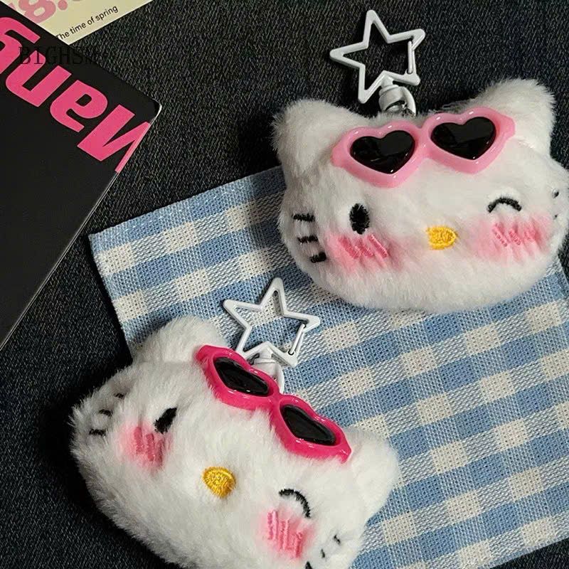 ** Móc khóa bông mặt Kitty đính kẹp xương cá