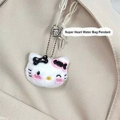 ** Móc khóa bông mặt Kitty đính kẹp xương cá