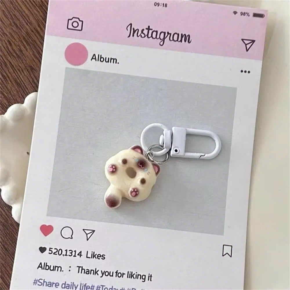 ** Móc khóa mini mèo ú bánh vòng