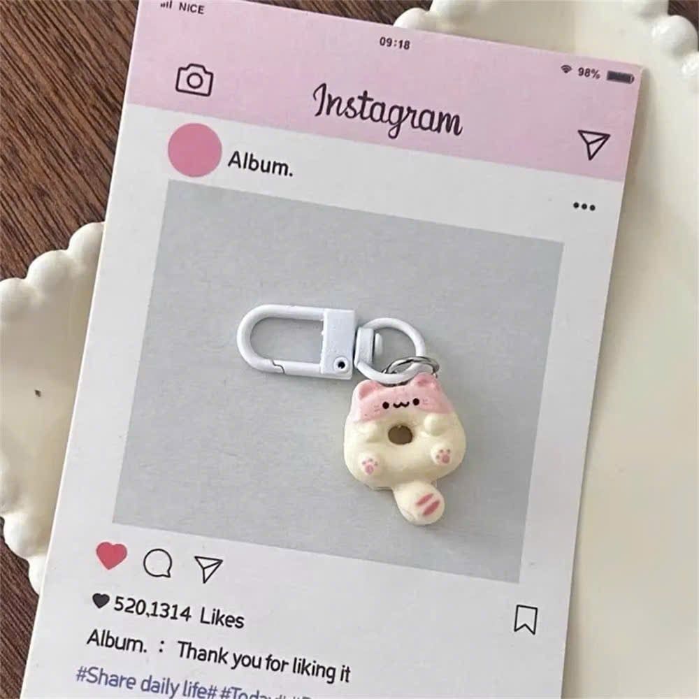 ** Móc khóa mini mèo ú bánh vòng