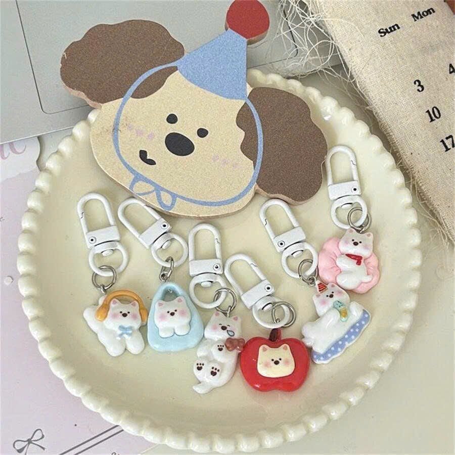 ** Móc khóa cún trắng mùa đông