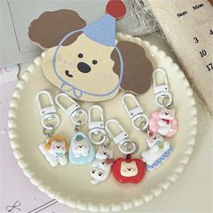 ** Móc khóa cún trắng mùa đông