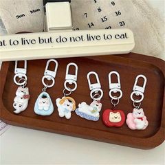 ** Móc khóa cún trắng mùa đông