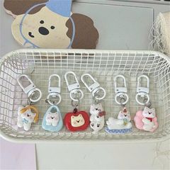 ** Móc khóa cún trắng mùa đông