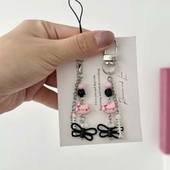 ** Móc khóa Kitty bướm đen