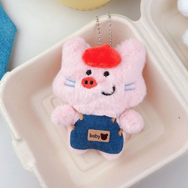 ** Móc khóa bông heo mặc yếm jeans đội mũ đỏ bóp kêu