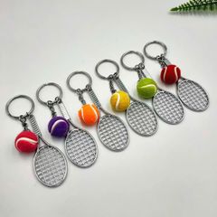 ** Móc khóa vợt Tennis và bóng xanh/cam/tím/đỏ