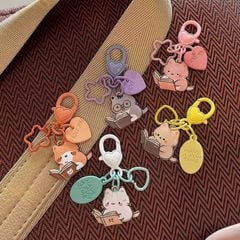 ** Móc khóa mini động vật đọc sách