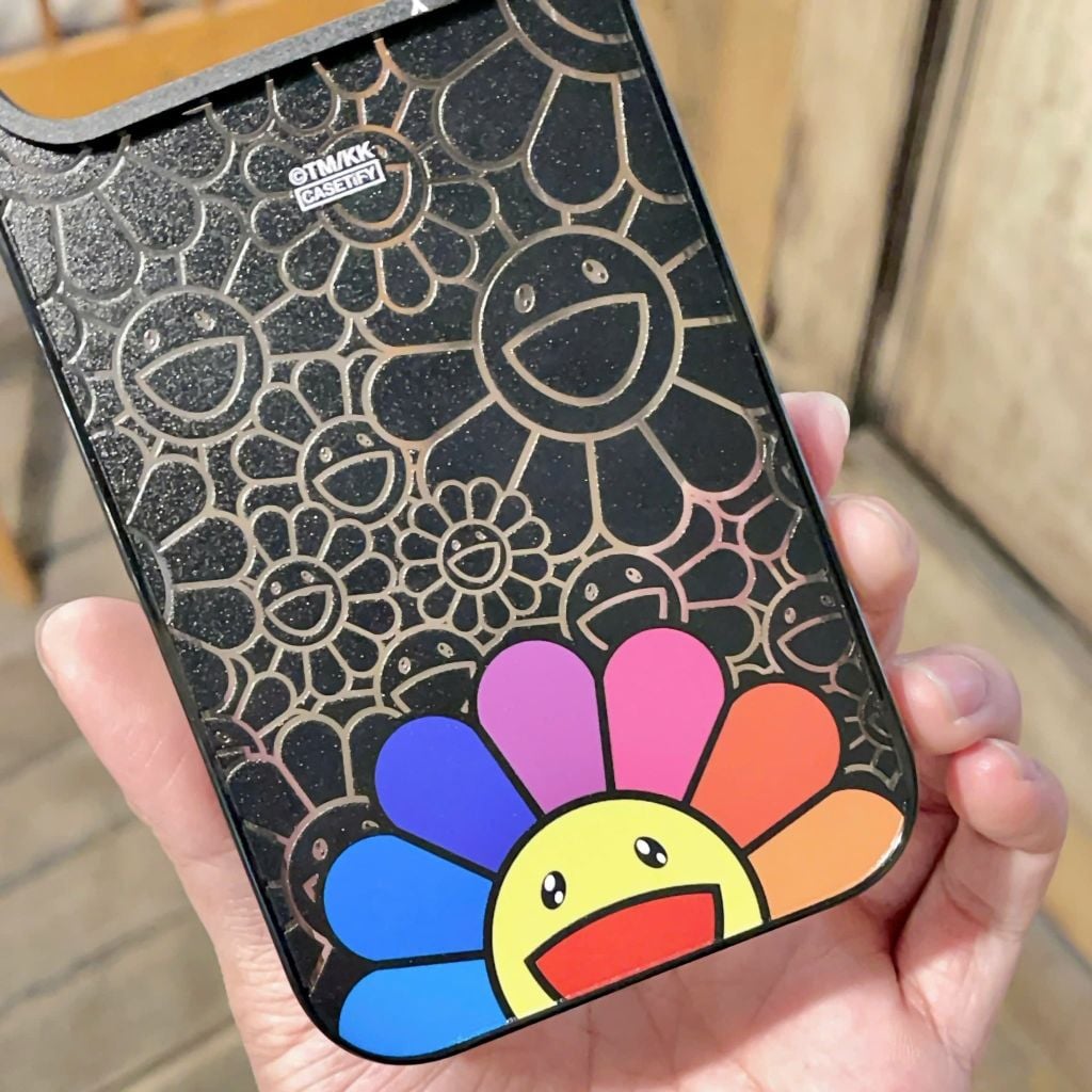 ** Ốp IP 17 Pro Max hoamặt cười đen