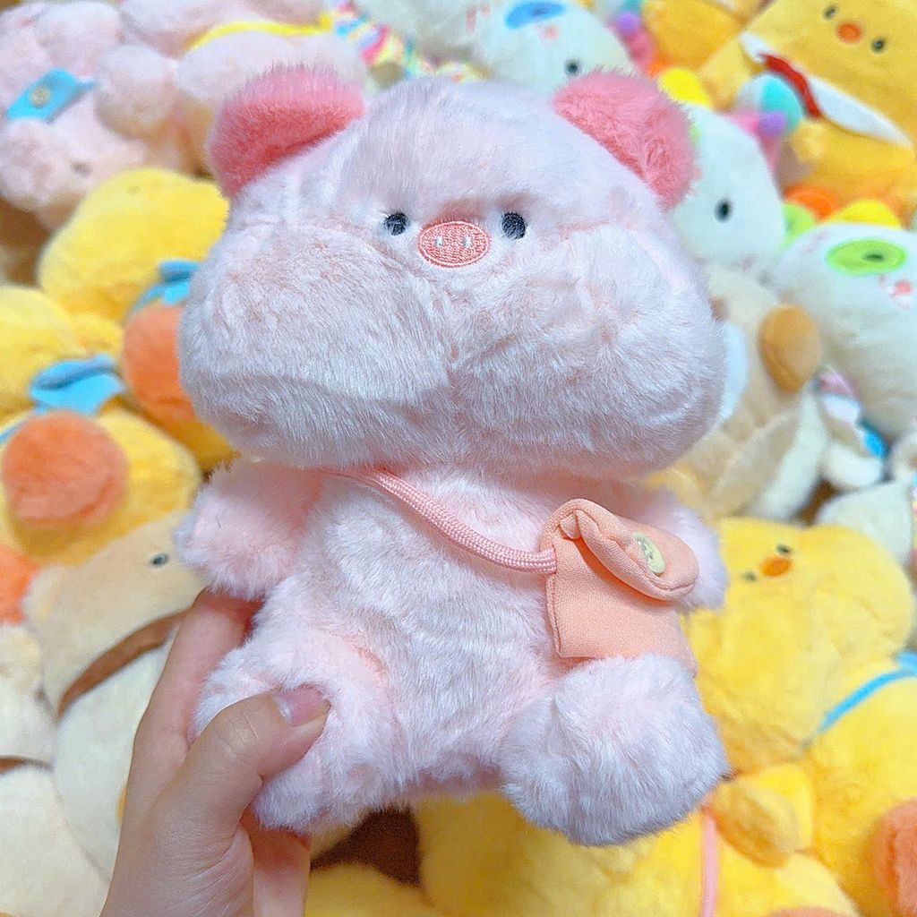 ** Gấu bông heo hồng đeo túi vàng/xanh