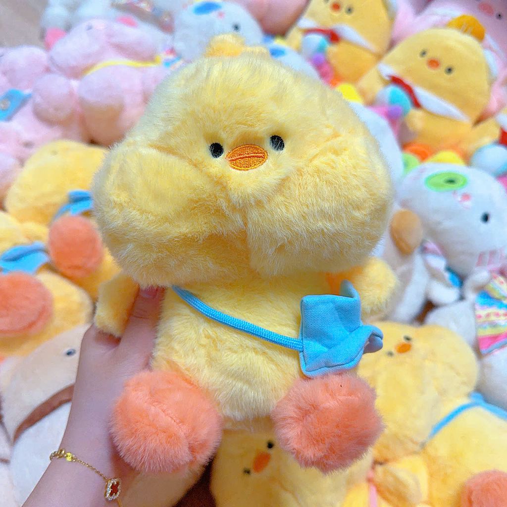 ** Gấu bông gà vàng đeo túi xanh/hồng