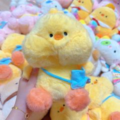 ** Gấu bông gà vàng đeo túi xanh/hồng