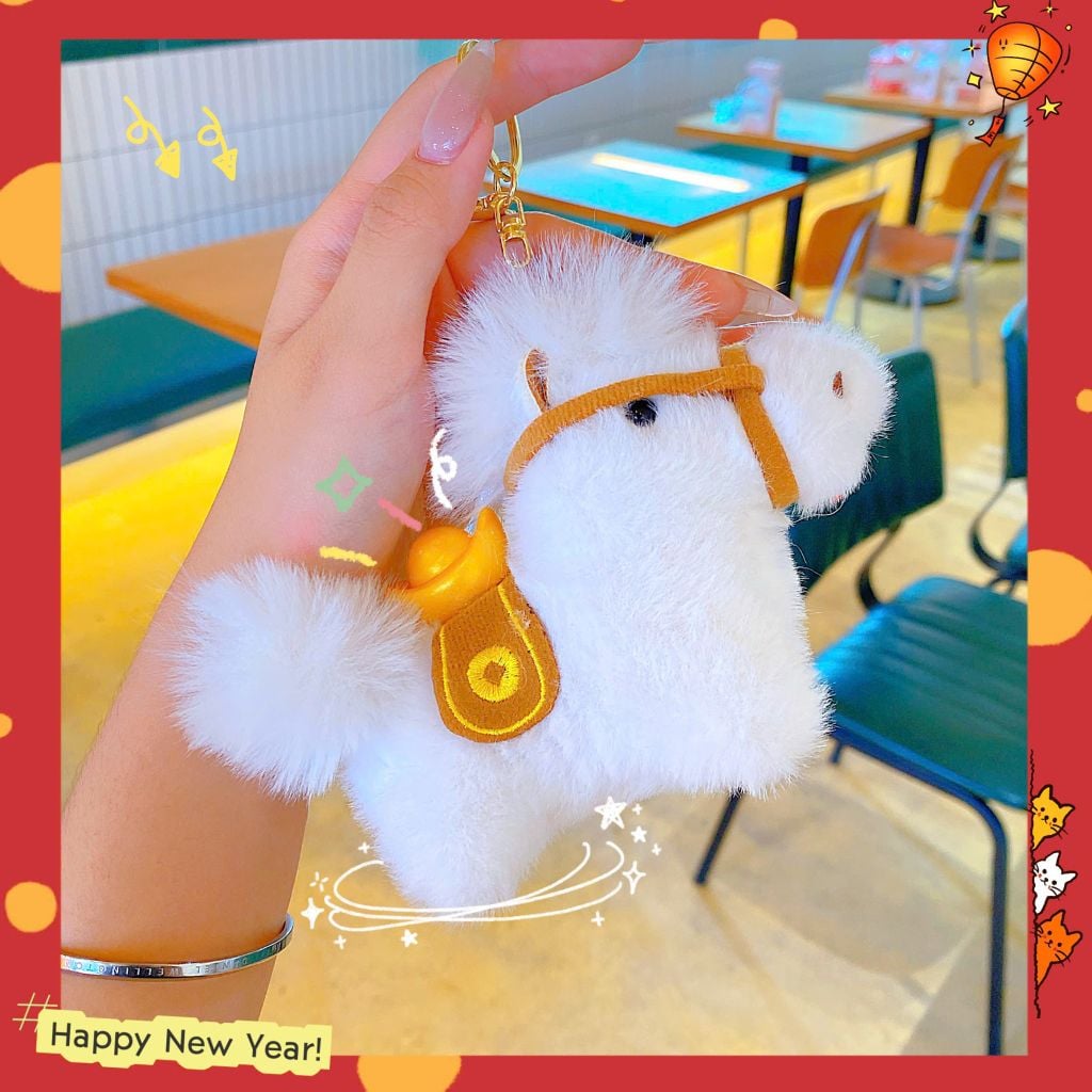 ** Móc khóa bông ngựa cõng thỏi vàng