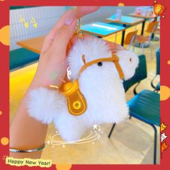 ** Móc khóa bông ngựa cõng thỏi vàng