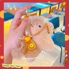 ** Móc khóa bông ngựa cõng thỏi vàng