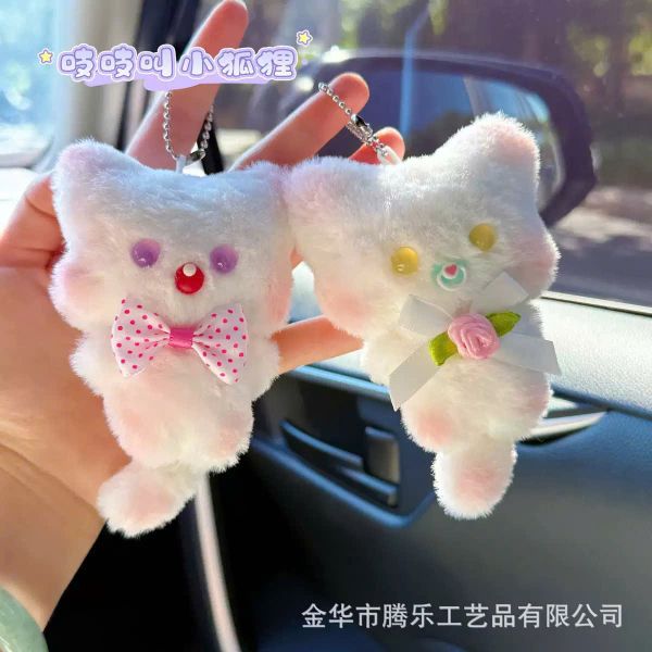 ** Móc khóa bông mèo trắng đeo nơ hồng chấm bi