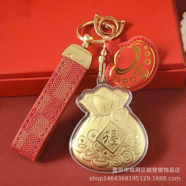 ** Móc khóa túi tiền vàng dây da kèm hộp