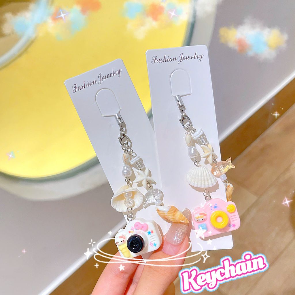 ** Dây đeo điện thoại vỏ sò máy ảnh nhiều màu