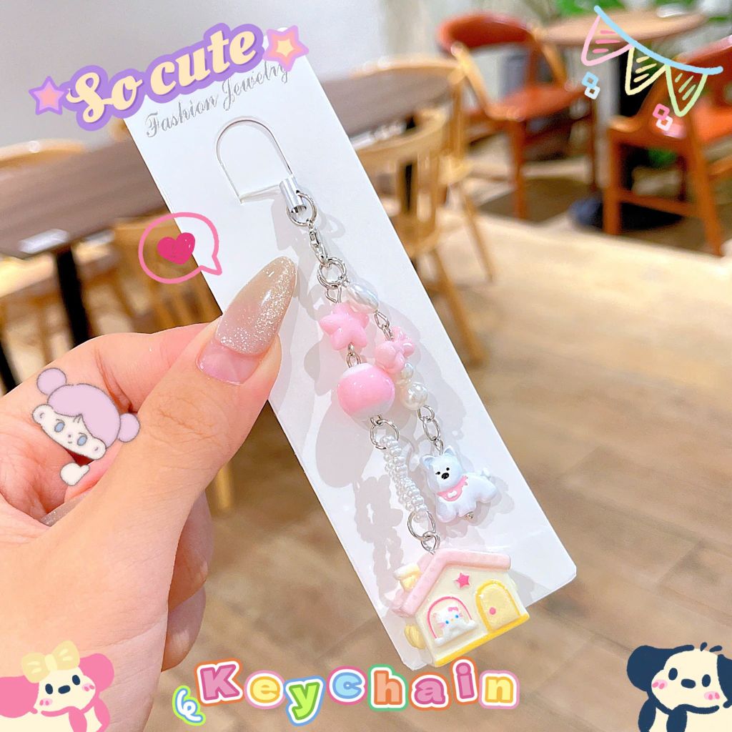 ** Dây đeo điện thoại cún trắng ngôi nhà mái hồng/xanh