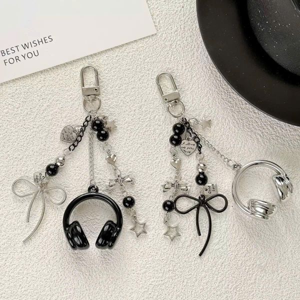 ** Móc khóa headphone đen/bạc mix nơ bạc