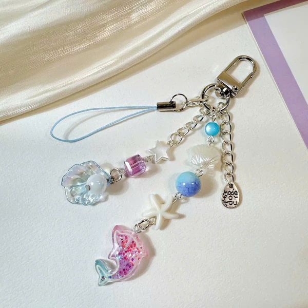 ** Móc khóa/dây đeo điện thoại cá heo kim tuyến sò biển