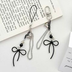 ** Móc khóa nơ đen trái tim bạc