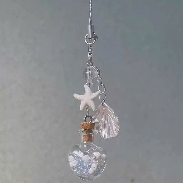 ** Dây đeo điện thoại lọ điều ước ngôi sao sò biển