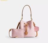  Túi Đeo Vai Coach Rowan Bucket Bag In Signature Canvas With Charms Powder Pink CEA23 
