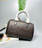  Túi Trống Coach Rowan Satchel Bag In Signature Canvas Màu Đen Logo CV961 