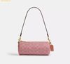 Túi Đeo Vai Coach Barrel Bag In Signature Canvas Melon Pink CDY79