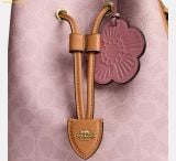  Túi Đeo Vai Coach Rowan Bucket Bag In Signature Canvas With Charms Powder Pink CEA23 