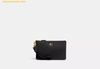 Ví Coach Polished Pebble Small Wristlet Màu Đen