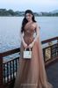 Cho thuê váy nâu dài chéo 1 bên vai JOSEPHINE đi du lịch đẹp