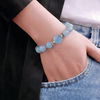  Vòng đá aquamarine charm hoa mẫu đơn 
