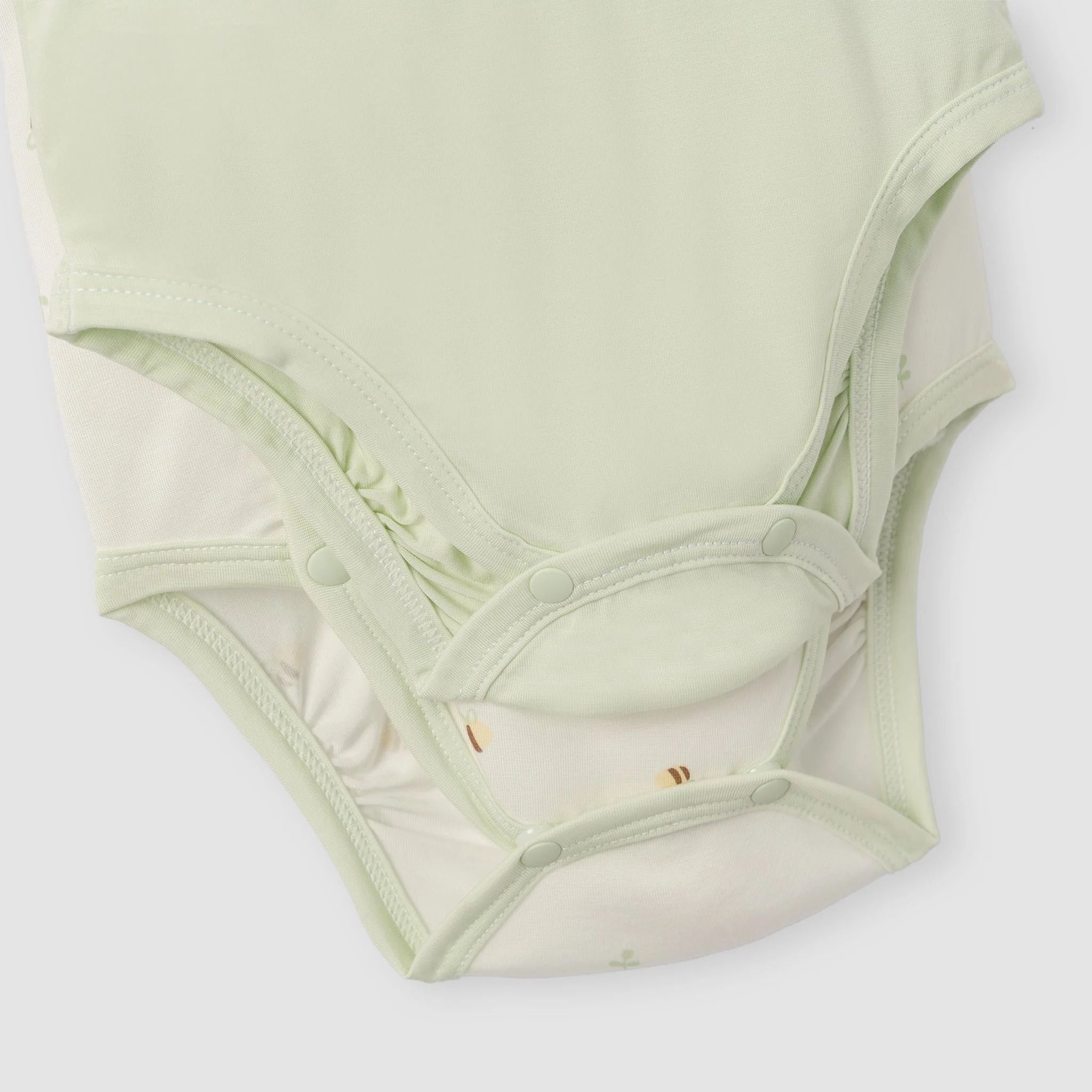  NOUS - Set 2 bodysuit cộc áo trắng họa tiết phối xanh lá 