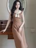  Đầm nâu phối nơ kem 